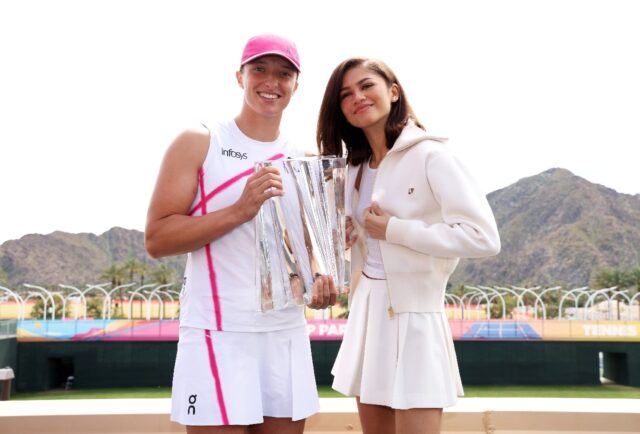 World number one Iga Swiatek, left, poses with her Indian Wells WTA trophy with actress Ze