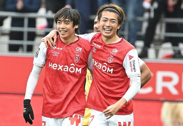 Junya Ito (L) celebrates with compatriot Keito Nakamura after scoring for Reims against Me