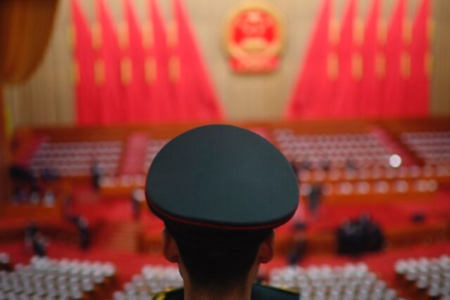 A member of the People's Liberation Army (PLA) band stands before the opening session of t