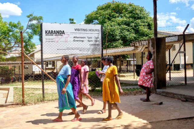 Pregnant women take a walk outside the maternity ward at Karanda Mission Hospital in Zimba