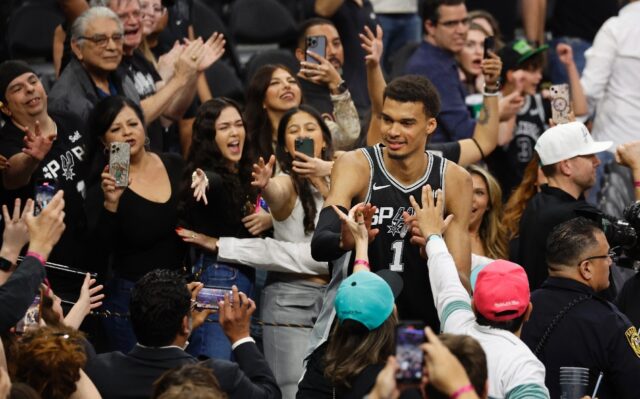 Sensational: San Antonio rookie Victor Wembanyama celebrates with fans after the Spurs' NB
