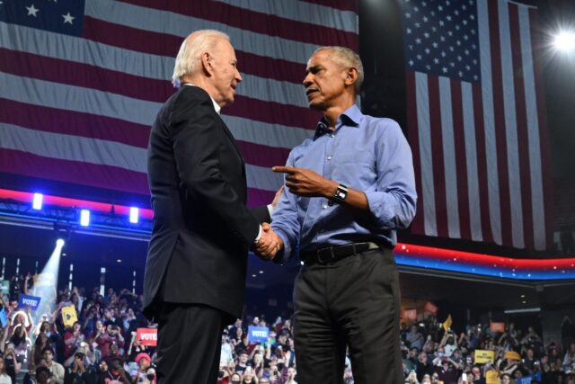 Former US President Barack Obama and US President Joe Biden participate in a rally in supp
