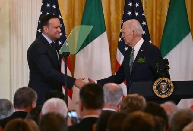 US President Joe Biden (R) shakes hands with Taoiseach of Ireland Leo Varadkar during a St