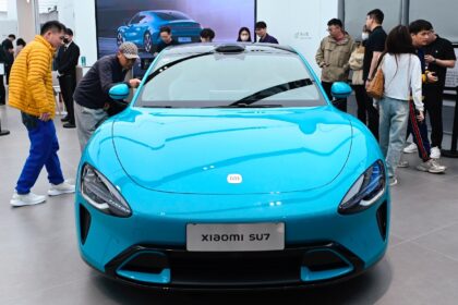 A Xiaomi SU7 electric car is displayed at a Xiaomi store in Beijing on March 26, 2024.