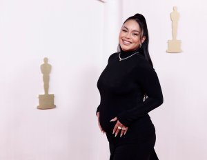 Vanessa Hudgens shows off baby bump on Oscars red carpet