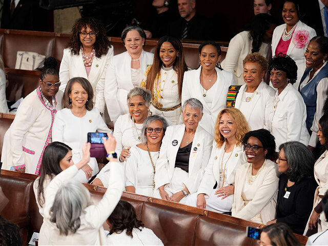Women members of the House of Representatives, pose for photos before President Joe Biden