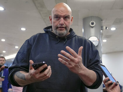 Sen. John Fetterman, D-Pa., speaks with reporters at the Senate Subway on Capitol Hill Wed