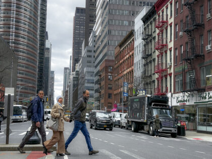 Pedestrians cross the street in New York on Thursday, April 5, 2024. An earthquake shook