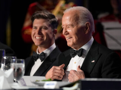 President Joe Biden, right, and host Colin Jost attend the White House Correspondents' Ass