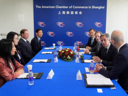 U.S. Secretary of State Antony Blinken, second right, meets with business leaders, Xiangwe