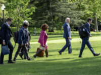 US President Joe Biden, second right, Bruce Reed, White House deputy chief of staff, right, and Karine Jean-Pierre, White House press secretary, center, walk on the South Lawn of the White House after arriving on Marine One in Washington, DC, US, on Thursday, April 18, 2024. Biden called it an "incredible honor" as he received endorsements from more than a dozen members of the Kennedy family, in a public show of force aimed at undercutting the presidential campaign of independent Robert F. Kennedy Jr.Photographer: Ron Sachs/CNP/Bloomberg via Getty Images