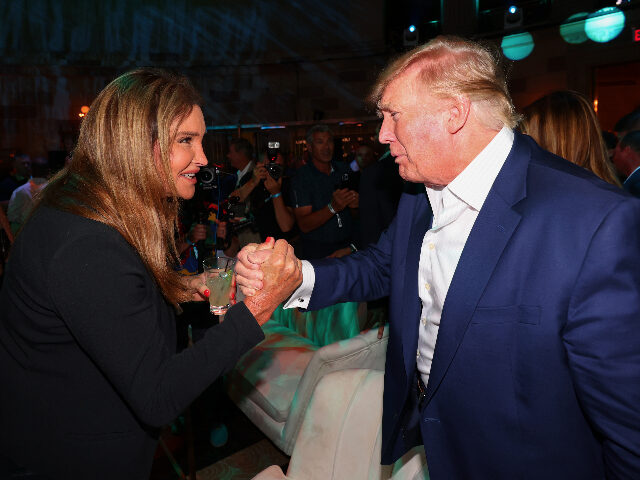 NEW YORK, NEW YORK - JULY 27: Caitlyn Jenner (L) shakes hands with former U.S. President D