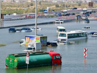Cars are stranded on a flooded street in Dubai following heavy rains on April 18, 2024. Du