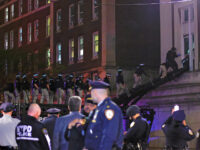 Biden - NYPD officers in riot gear break into a building at Columbia University, where pro