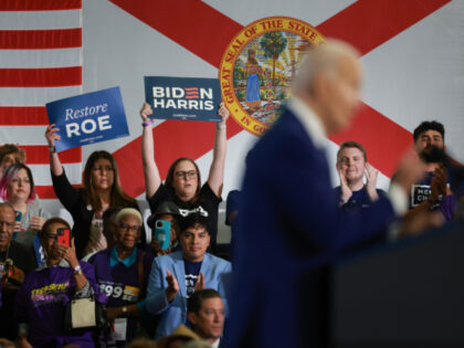 TAMPA, FLORIDA—APRIL 23: People cheer as President Joe Biden speaks during a campaign st