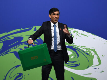 Britain's Chancellor of the Exchequer Rishi Sunak poses with a green briefcase similar to