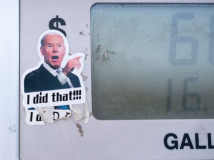 A sticker insinuates that President Joe Biden is responsible for high gas prices on a gas