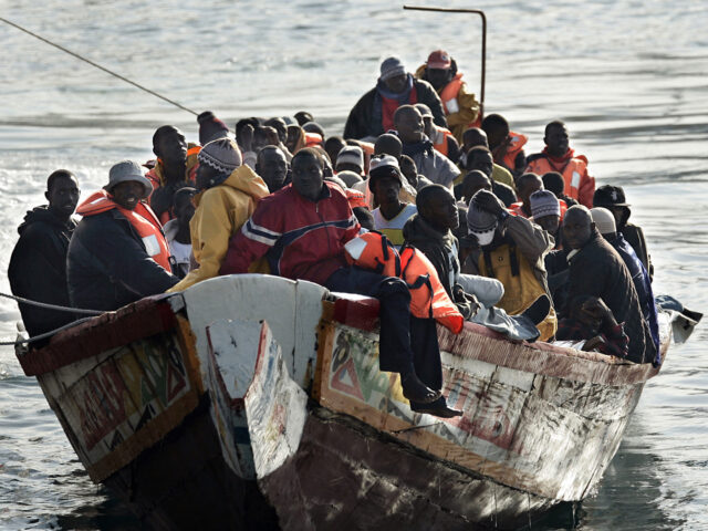 TOPSHOT - A boat with around 96 would-be illegal immigrants arrives at the port of Los Cri