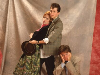 Molly Ringwald, Jon Cryer and Andrew McCarthy pose in costume on set for Pretty in Pink (d