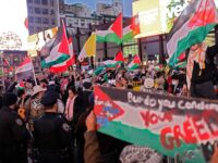 Pro-Palestine activists stop in front of Penn Station while marching in a Global Strike fo