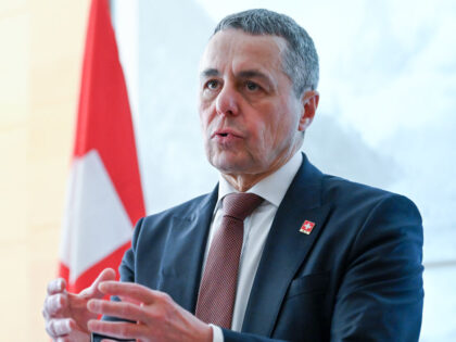 07 February 2024, China, Peking: The Swiss Foreign Minister, Ignazio Cassis, speaks at a p