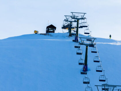 People skiing near Cortina d'Ampezzo, Italy, on February 4, 2024. A mild winter acros