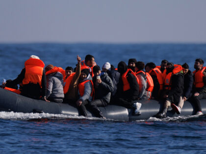 ENGLISH CHANNEL - MARCH 06: An inflatable dinghy carrying migrants crosses the English Cha