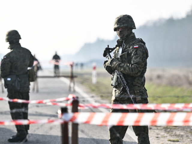 RUSKOWO, POLAND - MARCH 14: Polish soldiers stand guard by the Airport Road Section (DOL)