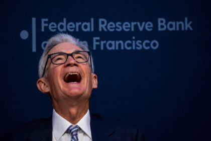 Jerome Powell, chairman of the US Federal Reserve, laughs during the Macroeconomics and Mo
