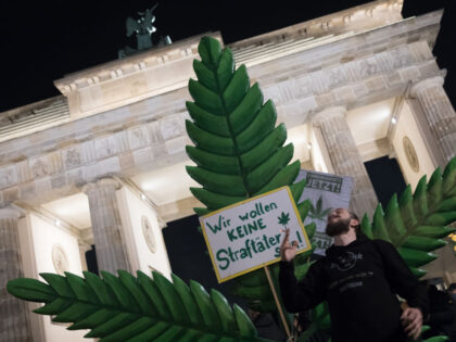 BERLIN, GERMANY - APRIL 1: Cannabis enthusiasts smoke joints legally at the Brandenburg Ga