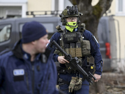 Finnish police officers investigate at the primary Viertola comprehensive school after a 1