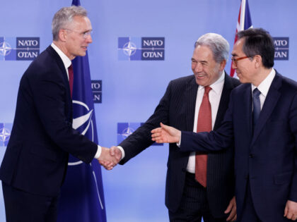 NATO Secretary General Jens Stoltenberg (L) shakes hands with New Zealand's Minister