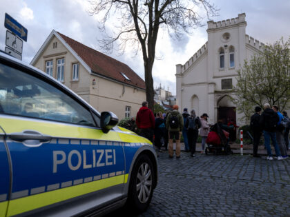 OLDENBURG, GERMANY - APRIL 5: A police car and people after an incendiary device was throw