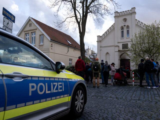 OLDENBURG, GERMANY - APRIL 5: A police car and people after an incendiary device was throw