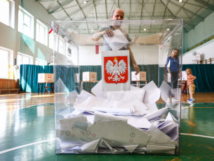 A man casts the ballots at a polling station in Polish local elections on April 7th in Kra