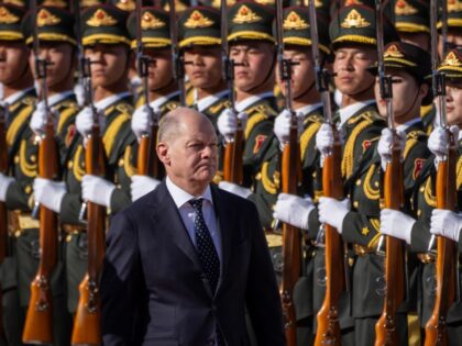 16 April 2024, China, Peking: Federal Chancellor Olaf Scholz (SPD) is received with milita