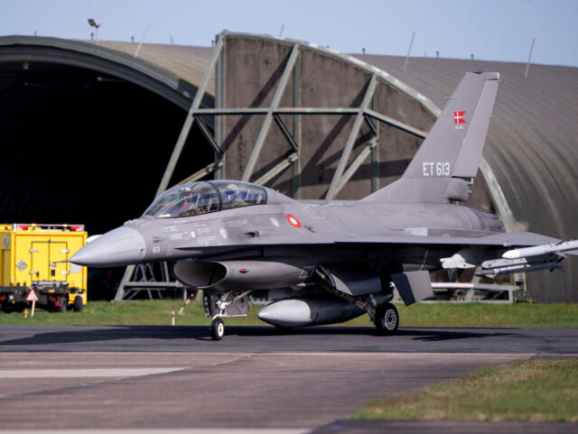 Argentina's Minister of Defence Luis Petri (R) arrives in a Danish F-16 aircraft at S
