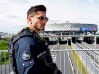 PARIS, FRANCE - APRIL 23: A French Police officer stands guard in front of the Terminal 1a