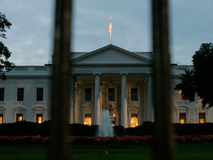 The early morning sun begins to rise behind the White House October 24, 2005 in Washington