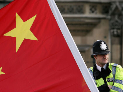 LONDON - NOVEMBER 09: A policeman stands by a large Chinese flag as President Hu Jintao ar
