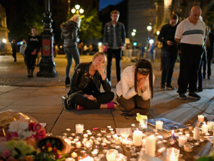 MANCHESTER, ENGLAND - MAY 23: Members of the public attend a candlelit vigil, to honour th