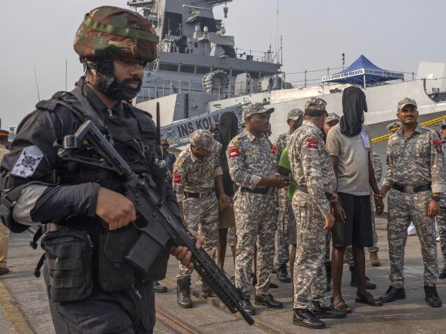 A police officer stands guard as Mumbai Police take charge of the accused Somali pirates b
