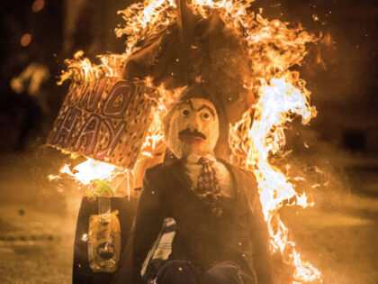 A dummy of Venezuelan President Nicolas Maduro is burnt as the "Burning of Judas&quot
