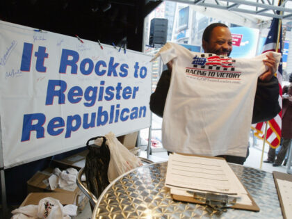 NEW YORK - MARCH 25: Arthur J. Cheatham III shows off his free t-shirt after registering t