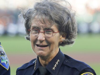 Oakland, Calif., Police Chief Anne Kirkpatrick stands before a baseball game, July 25, 201