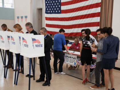 People voting at a polling place.