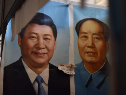 This photo taken on September 19, 2017 shows painted portraits of Chinese President Xi Jin
