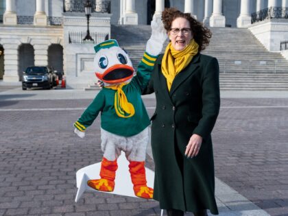 WASHINGTON - JANUARY 12: Rep. Val Hoyle, D-Ore., poses for photos with a cutout of the Uni
