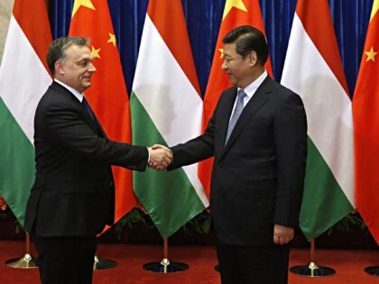 Hungary Prime Minister Viktor Orban (L) and Chinese President Xi Jinping (R) shake hands b