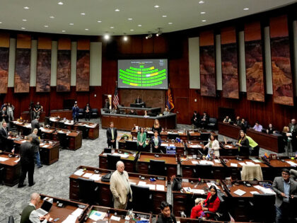 FILE - Arizona state representatives convene on House floor at the Capitol, Wednesday, Apr